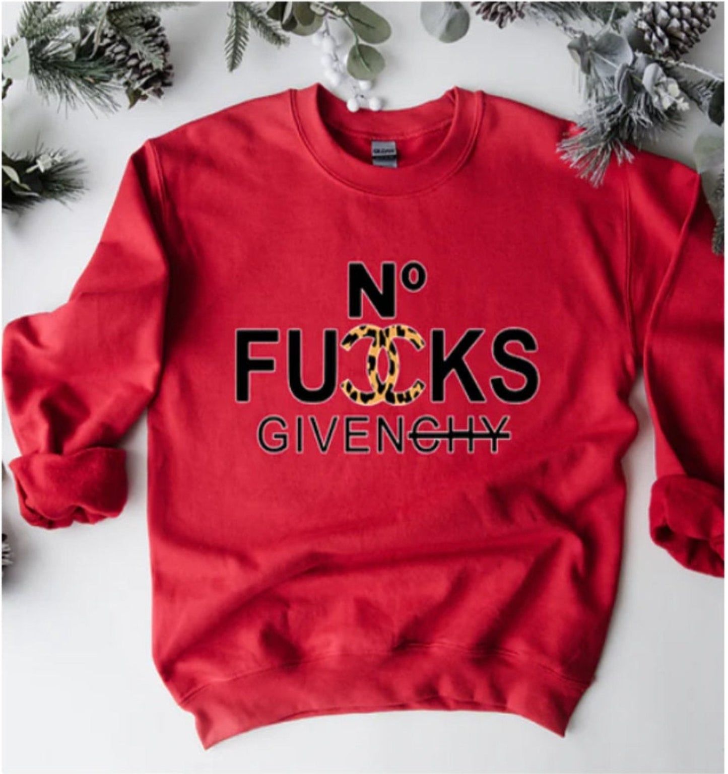 A red sweatshirt with leopard print and the text 'NO FUCKS GIVEN' printed on the front.
